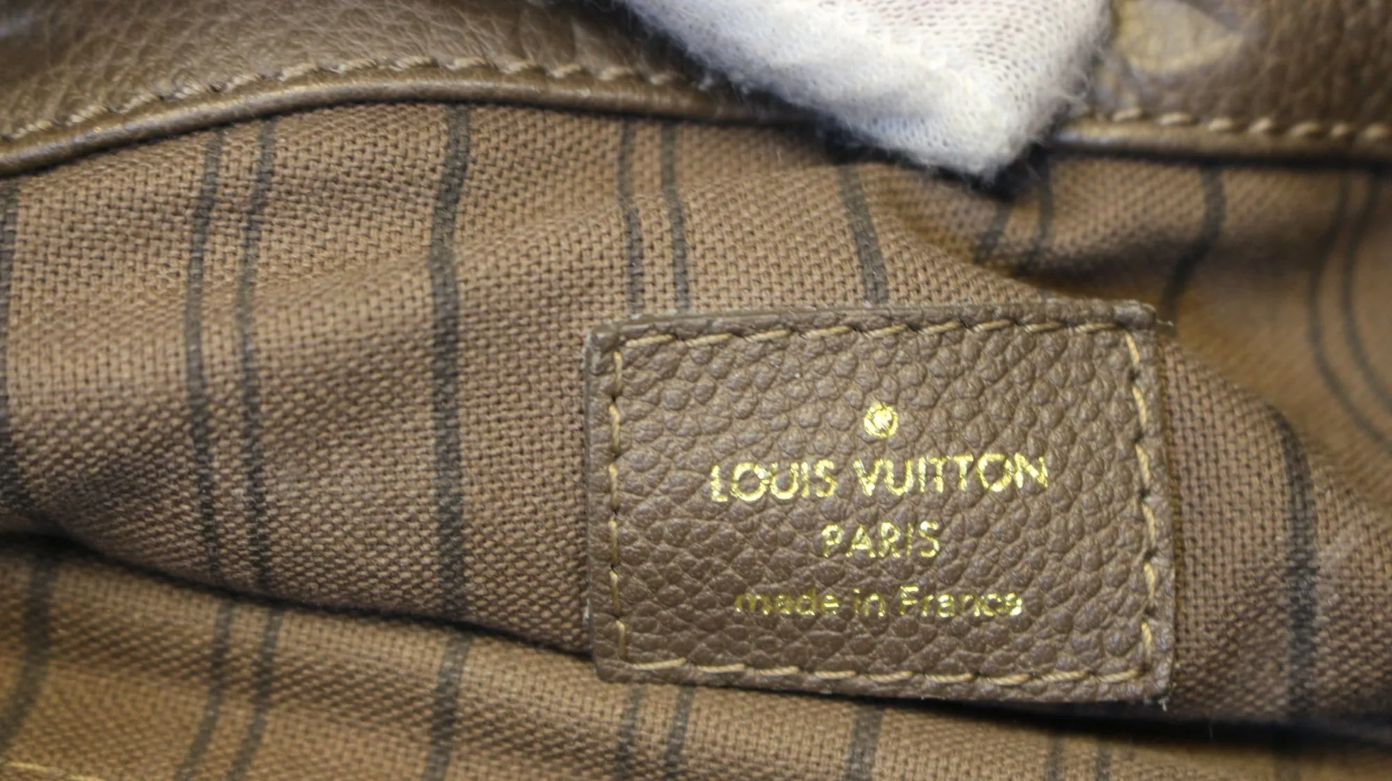 LOUIS VUITTON Terre Monogram Empreinte Leather Artsy MM Shoulder Bag